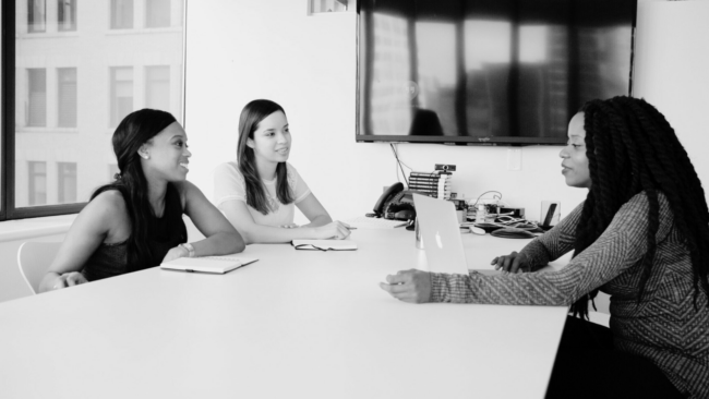 A picture of 3 people during a performance evaluation